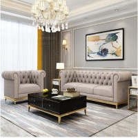 北欧现代轻奢客厅皮艺拉扣沙发设计师样板间港式镀钛金色布艺沙发